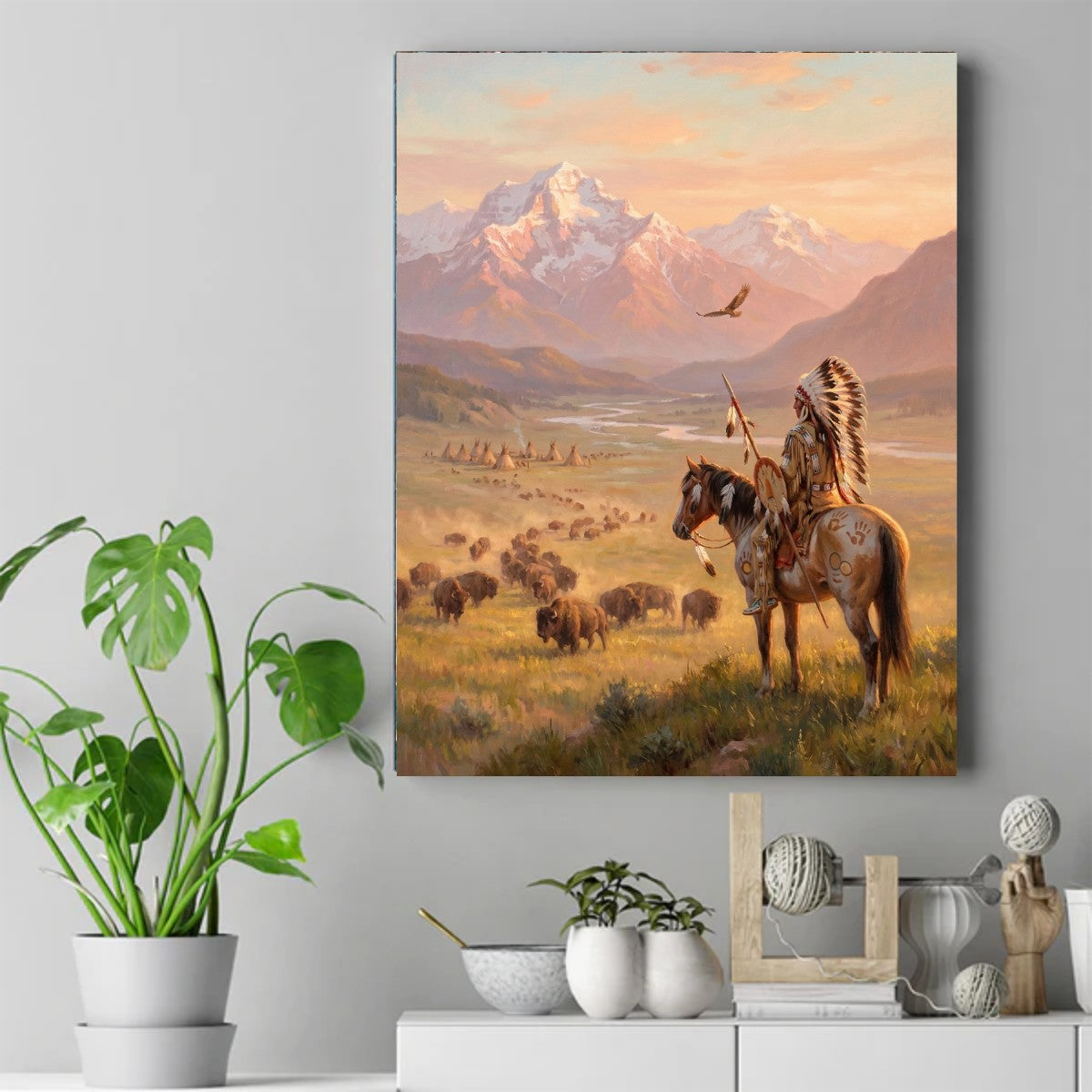 Native American rider on a horse in a feathered headdress overlooking bison, teepees, and mountains at sunset – ảnh 2