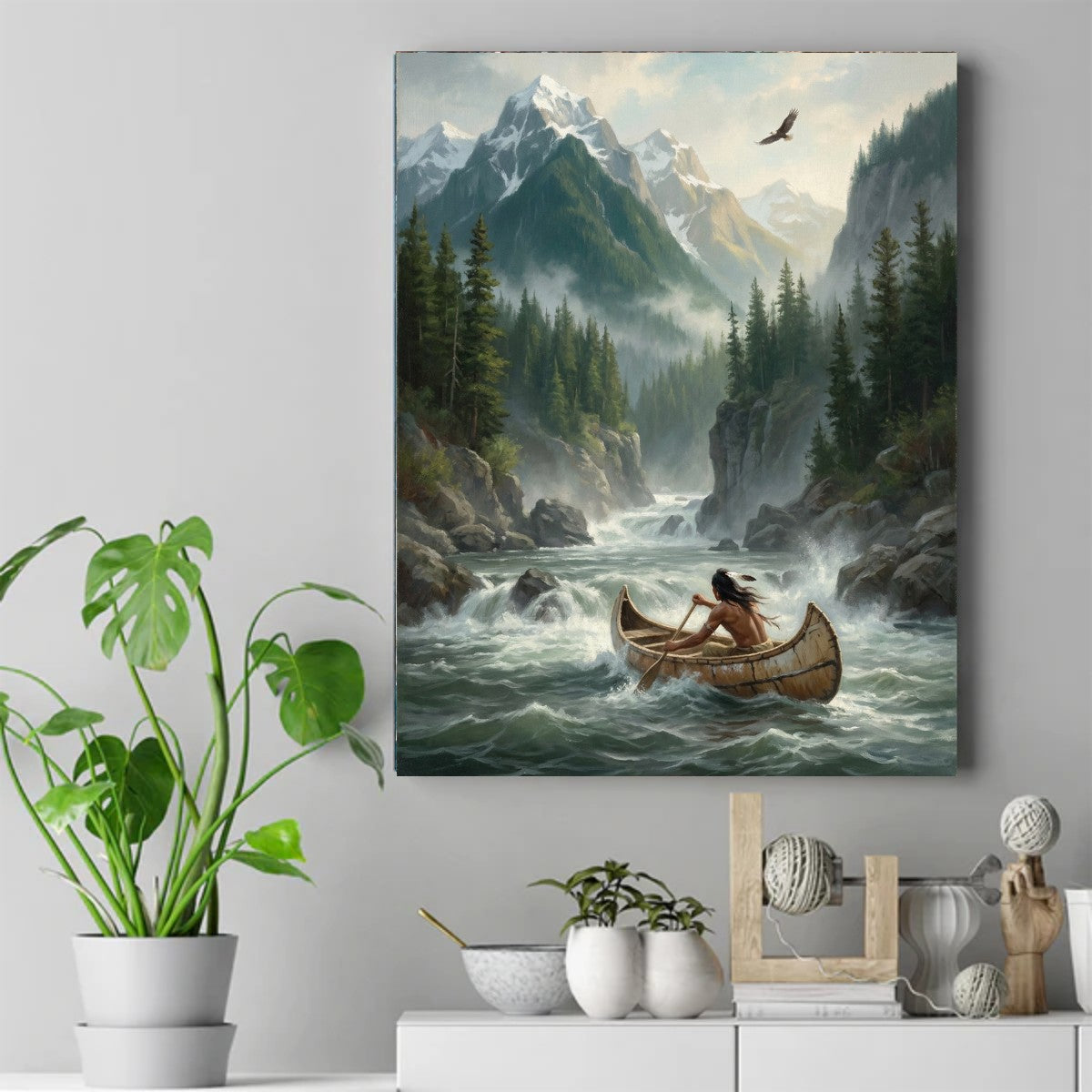 Native man paddling a wooden canoe through whitewater rapids, snowy mountains and pines behind, an eagle overhead – ảnh 2