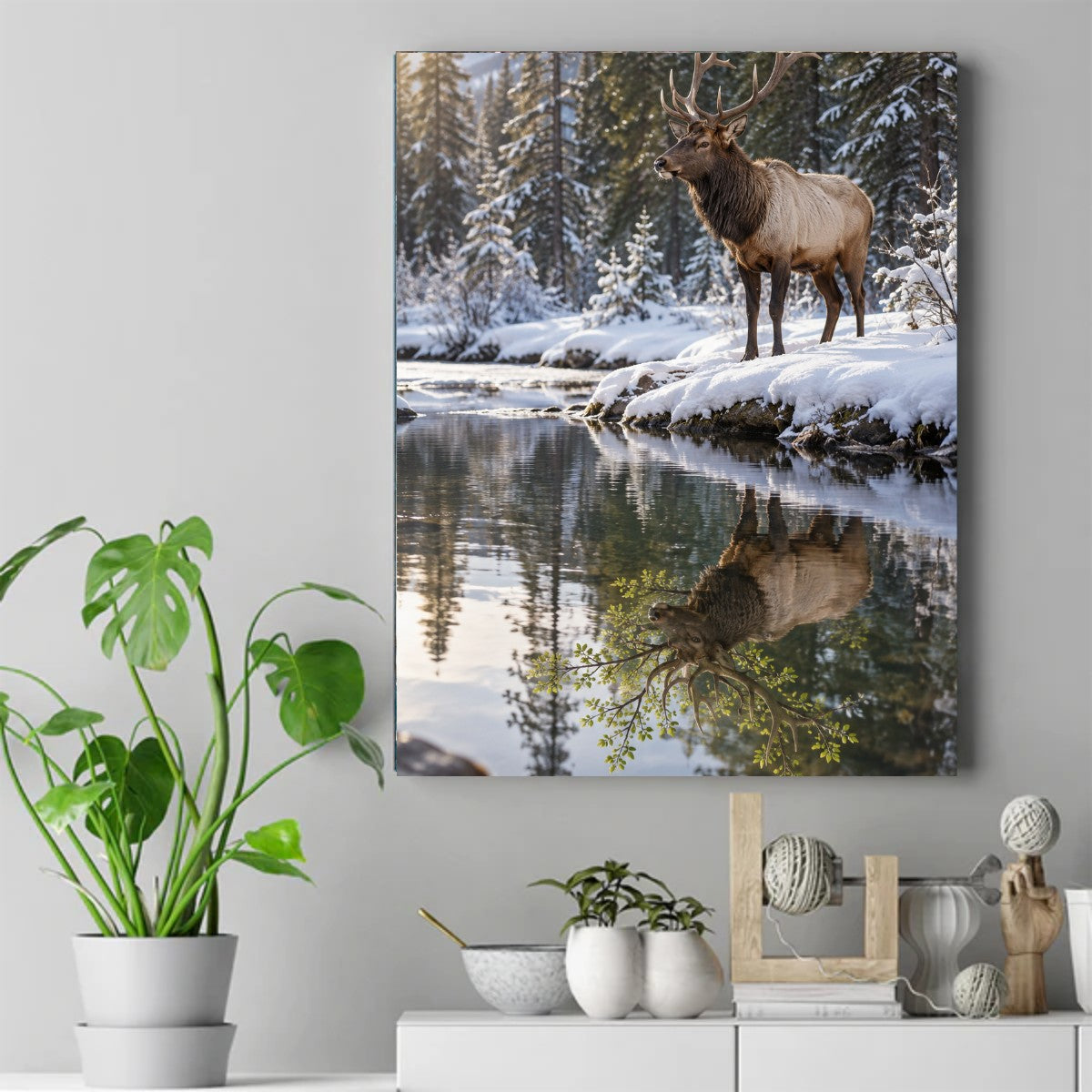 Bull elk with large antlers standing on a snowy riverbank, golden morning light, pine forest, and reflection in calm water. – ảnh 2