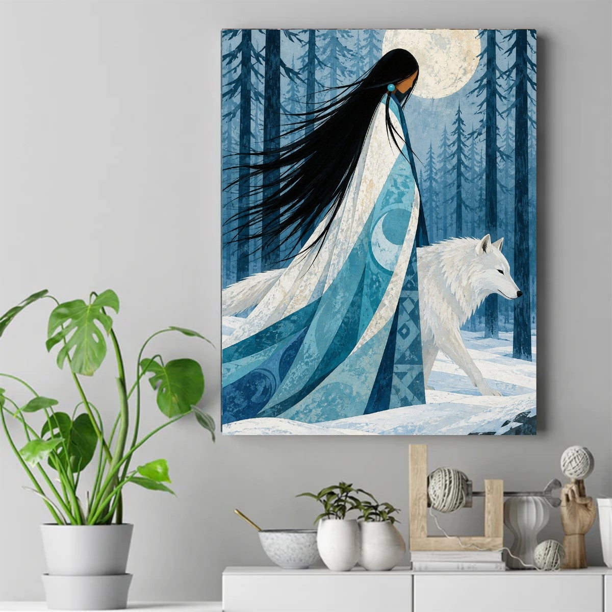 Native woman in a blue moon-patterned robe walking with a white wolf through snowy pine trees under a full moon – ảnh 2