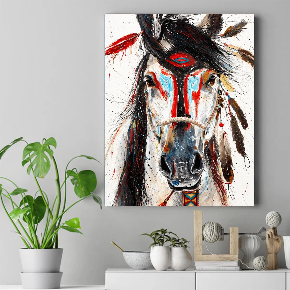 Close-up painted horse head with red and blue face paint, feathers, and beaded strap. – ảnh 2