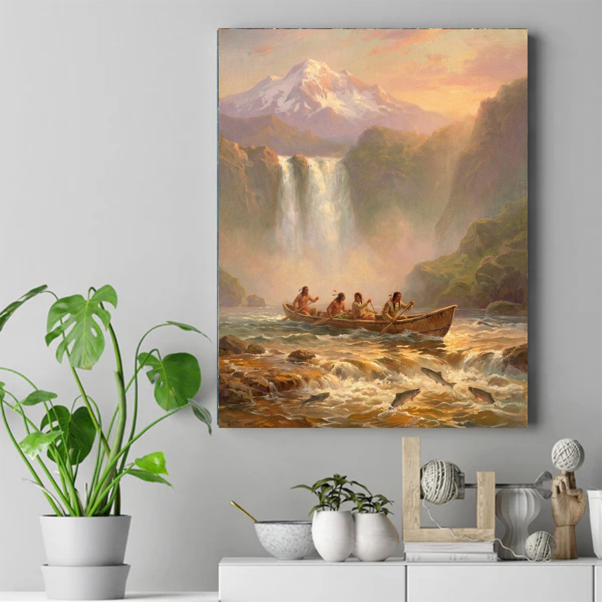 Four Native figures paddling a canoe through rapids with leaping salmon, waterfall and snowy mountain behind them – ảnh 2