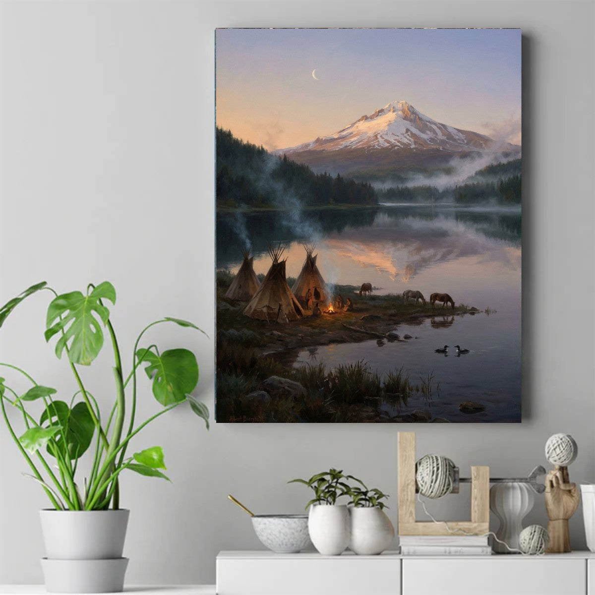 Teepees and a small campfire beside a mountain lake at sunset, with grazing horses, mist and a crescent moon – ảnh 2
