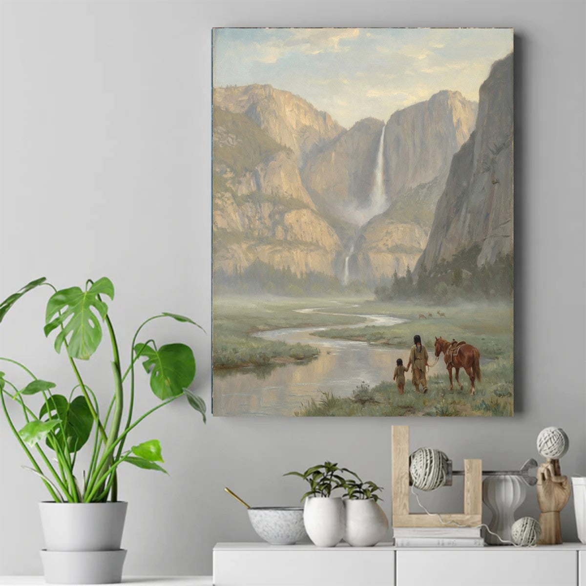 Painting of a Native father and child holding hands, walking with a horse by a river below a tall waterfall and cliffs. – ảnh 2