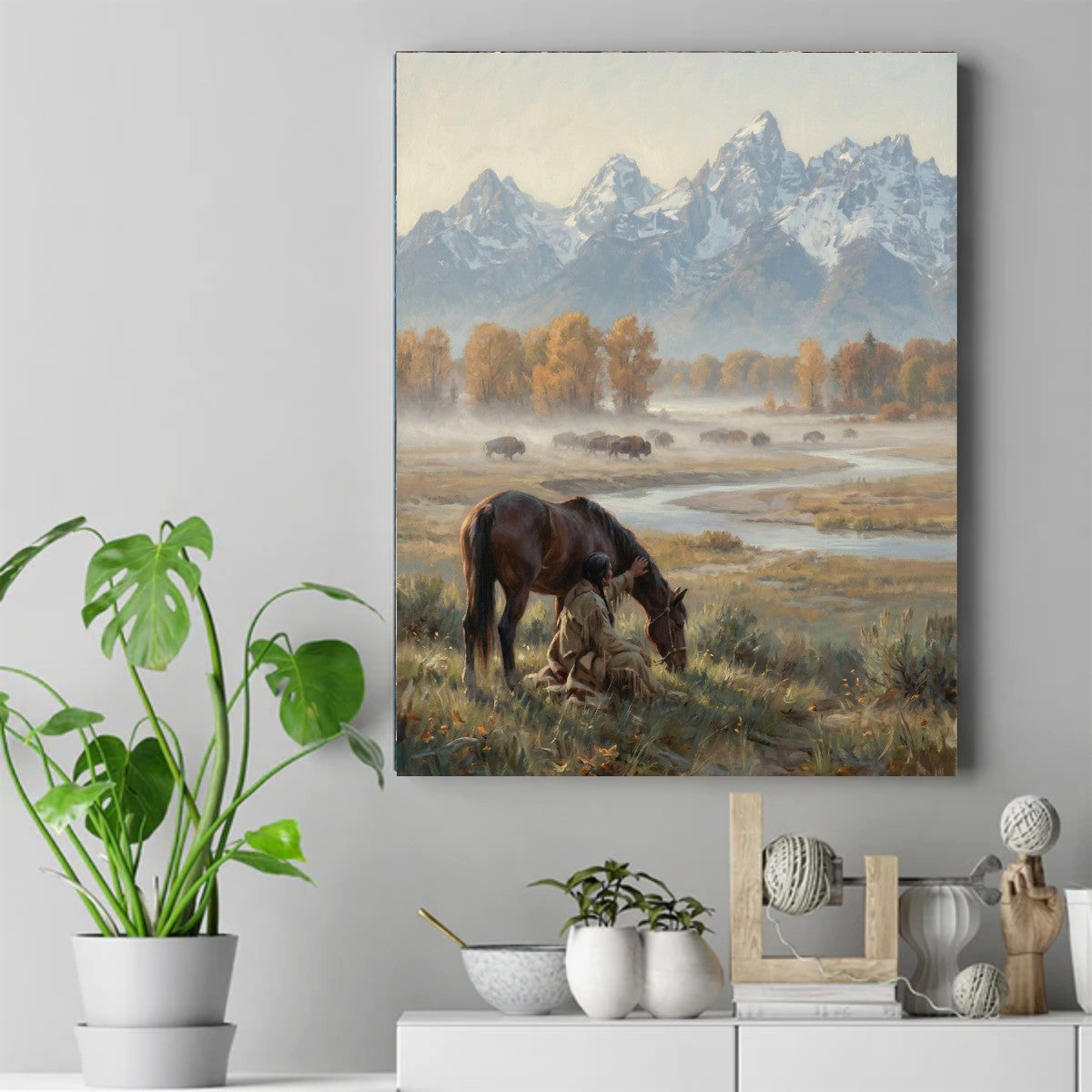 Native man kneeling beside a brown horse, with a bison herd grazing in a misty autumn valley below snowy mountains – ảnh 2