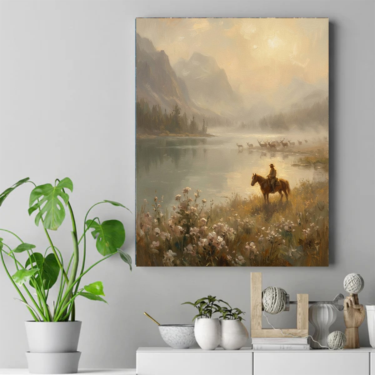 Native rider in a wide-brim hat on a brown horse beside a misty lake at golden hour, deer wading in the water – ảnh 2
