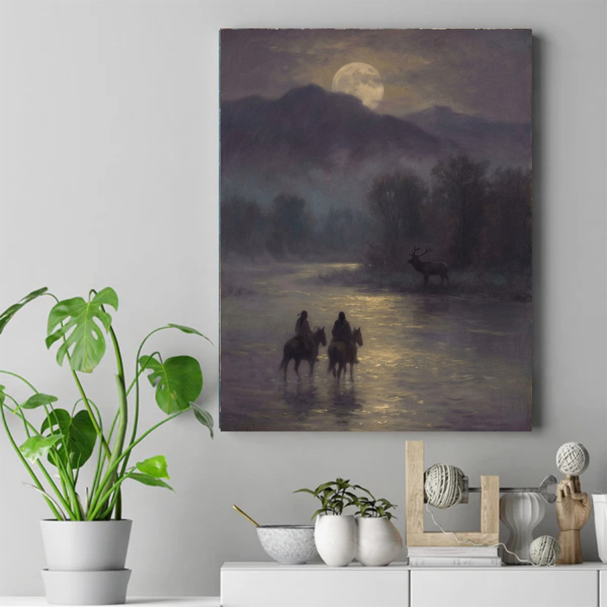 Two Native riders on horseback in a moonlit river, with an elk on the bank and a full moon behind the mountains. – ảnh 2