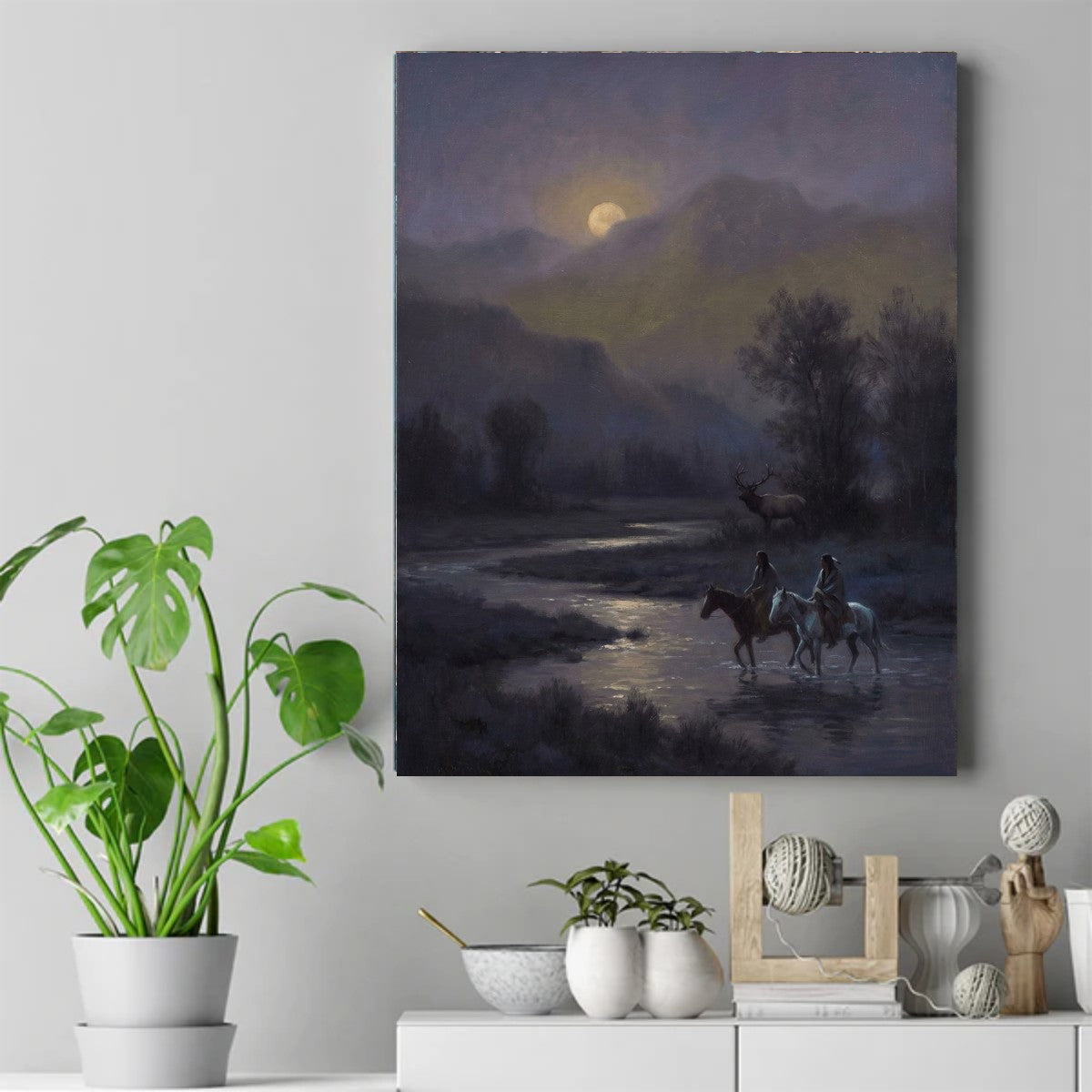 Two riders on horseback crossing a moonlit river, with an elk standing among trees beneath hazy mountains – ảnh 2
