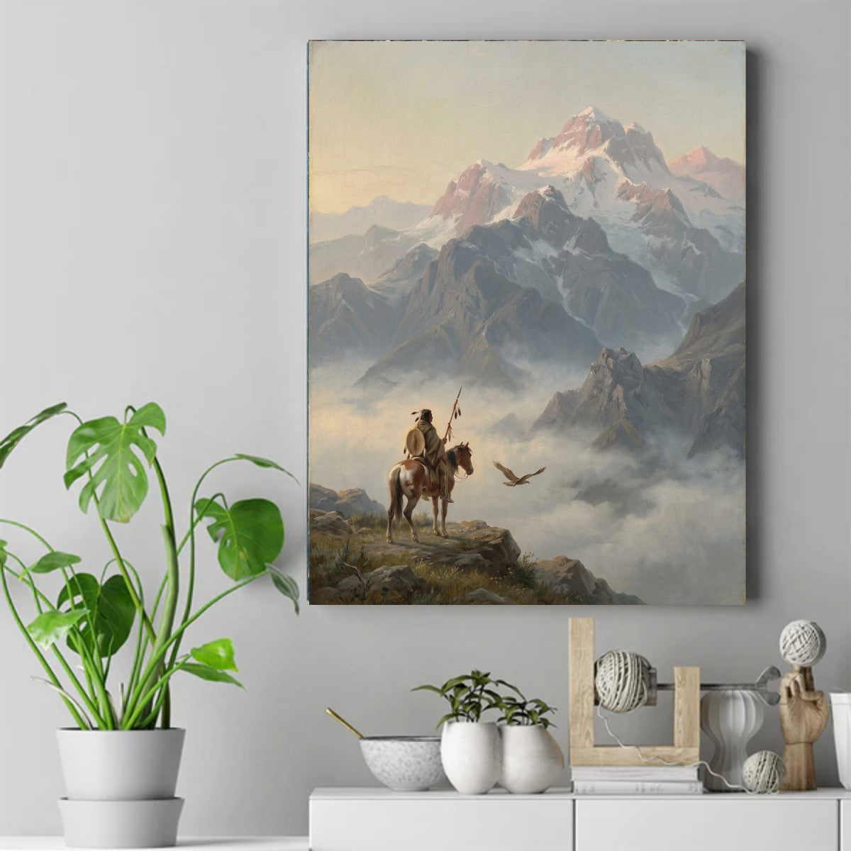 Native rider on a pinto horse holding a feathered lance, watching an eagle fly over clouds below snow-capped mountains. – ảnh 2