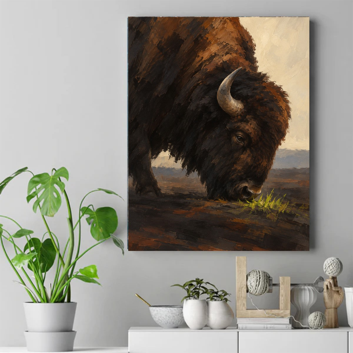A dark brown bison with one visible curved horn grazing on bright green grass under a pale sky with distant hills. – ảnh 2