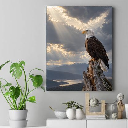 Bald eagle perched on a weathered stump as sunbeams break through clouds over misty mountains and a river valley – ảnh 2
