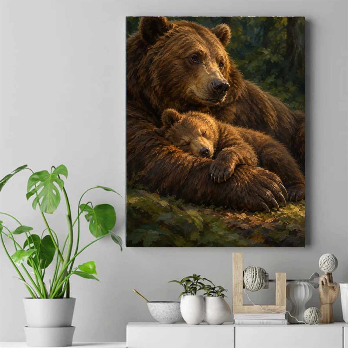 Large brown mother bear resting in forest light with a sleeping cub curled over her front paw – ảnh 2