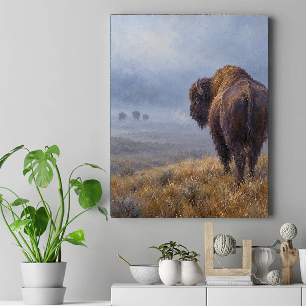 Painting of a lone bison in golden prairie grass with three bison in the misty background. – ảnh 2