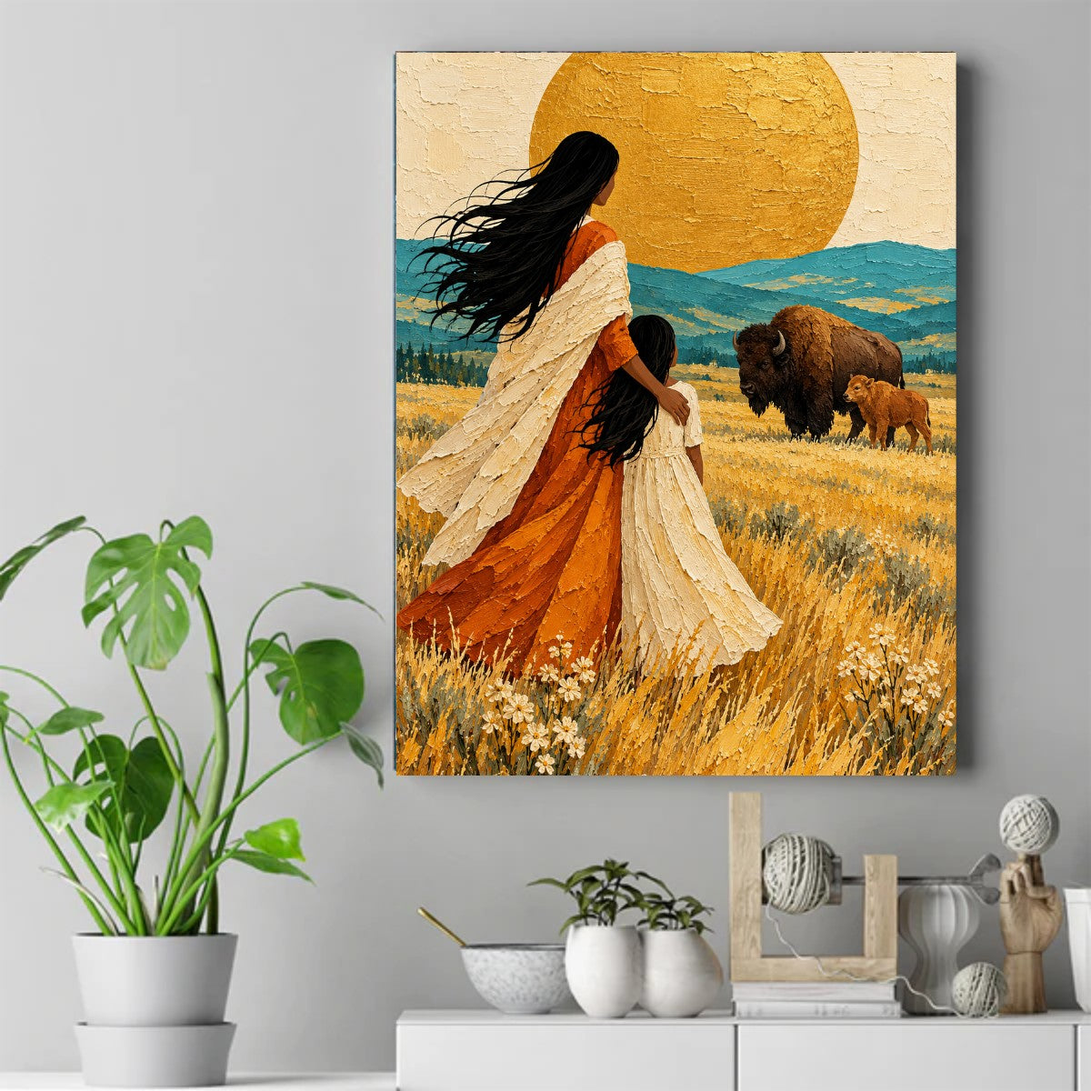A Native mother with her arm around a girl in white, watching a bison and its calf in a golden field under a large sun. – ảnh 2