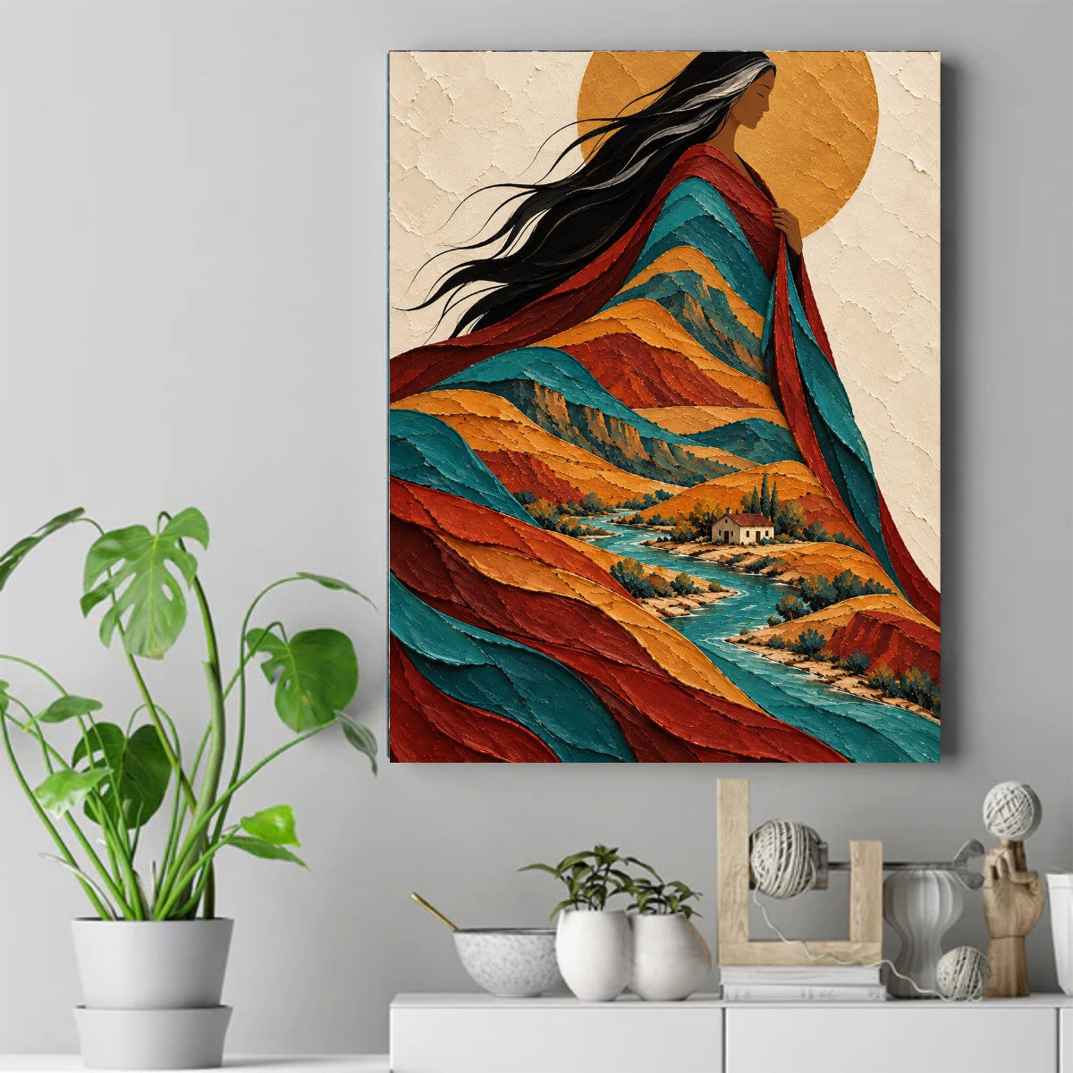 Native grandmother in profile, her long hair flowing into rust and teal mountains above a jade-blue river and a small house. – ảnh 2