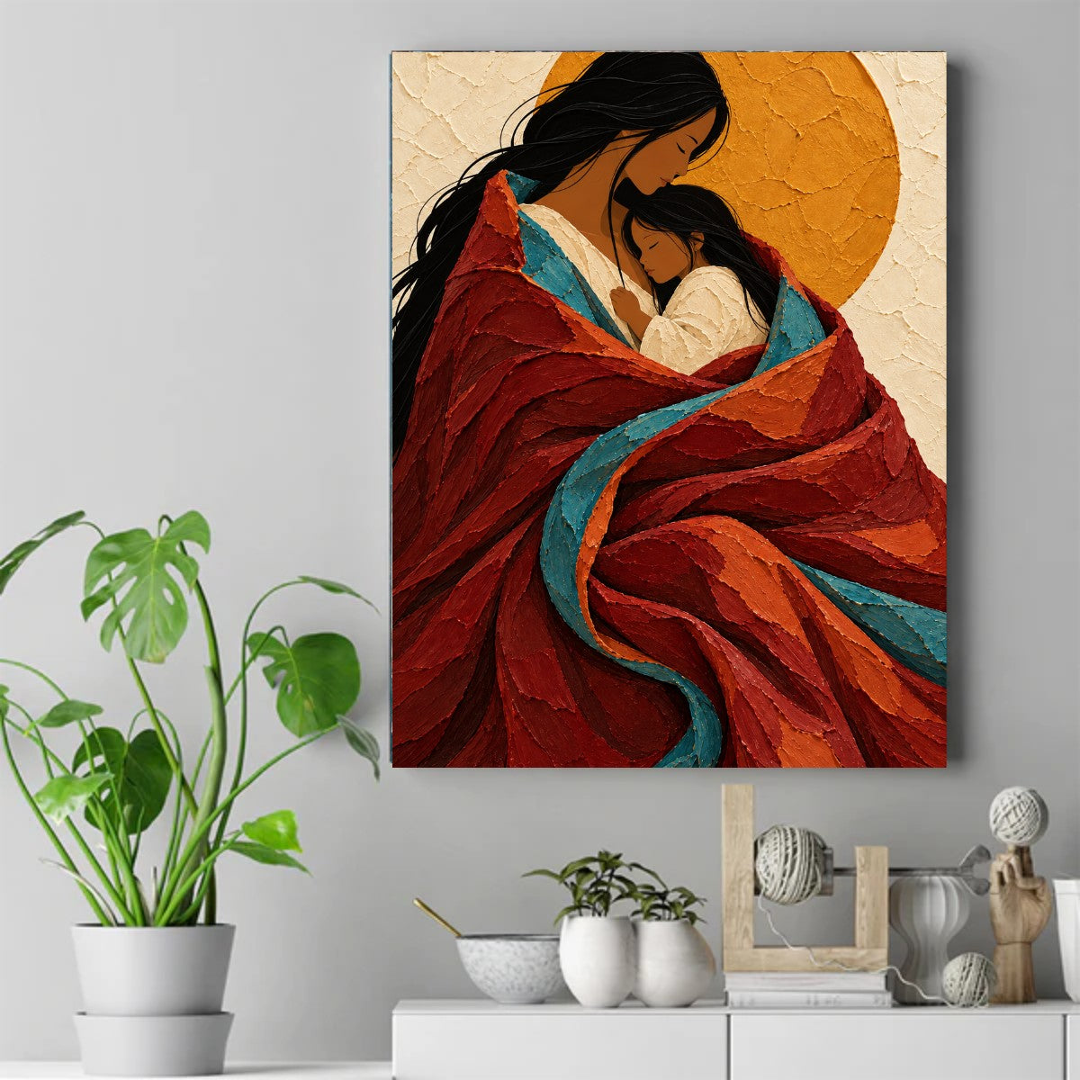 Mother and child with eyes closed, wrapped in a red blanket with blue stripe, gold circle behind. – ảnh 2