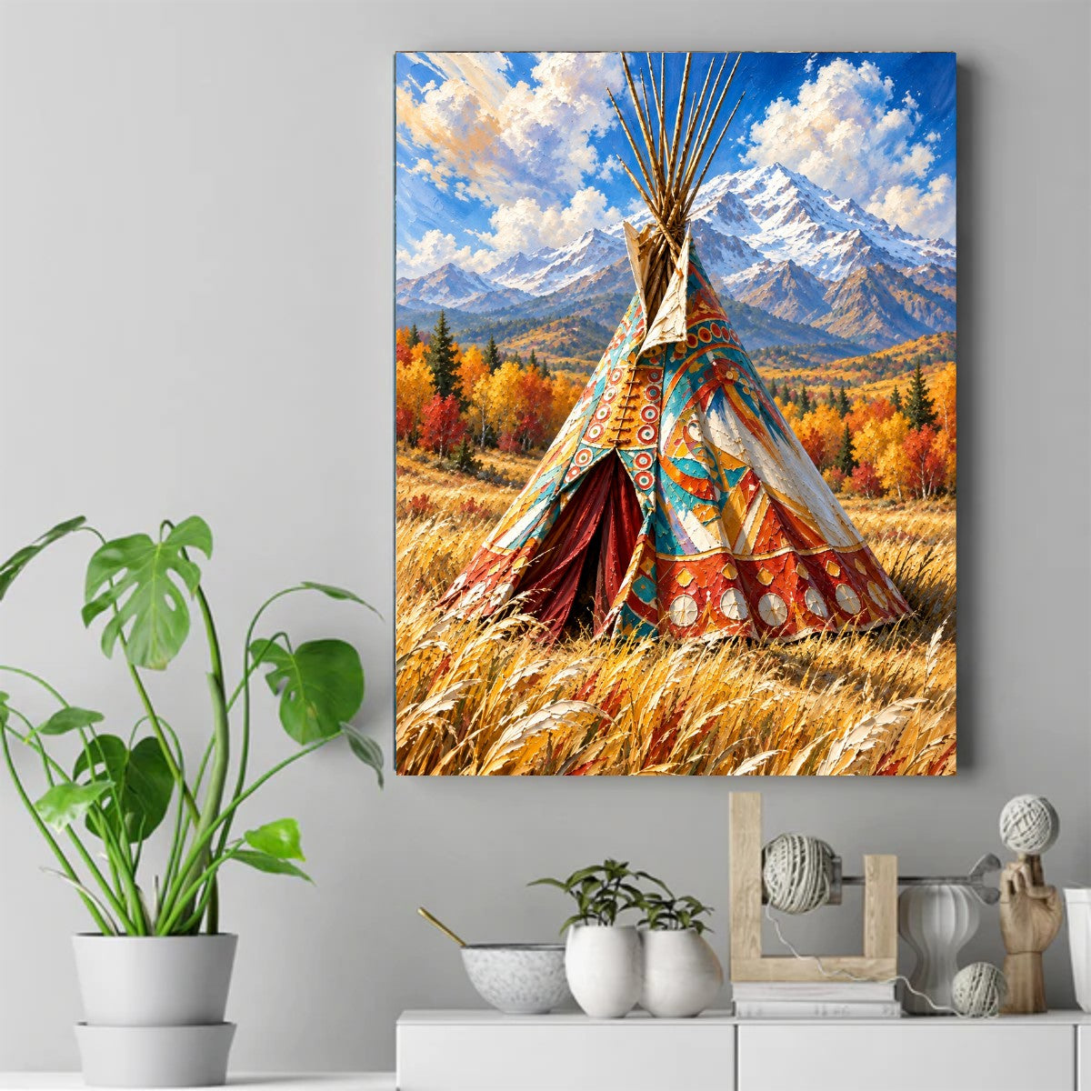 Colorful painted teepee in tall golden grass with autumn trees, snow-capped mountains, and blue cloudy sky – ảnh 2